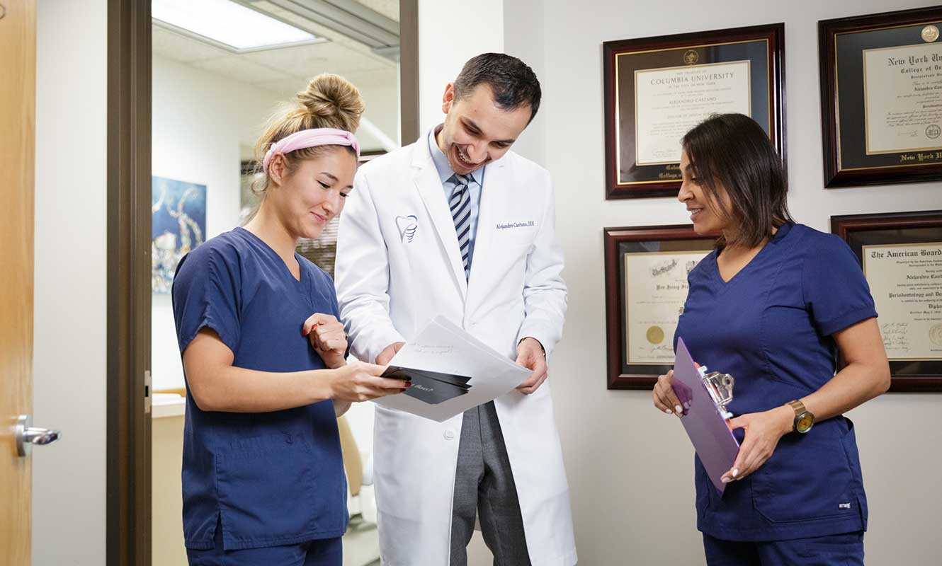 Denville Periodontist Looking At XRays