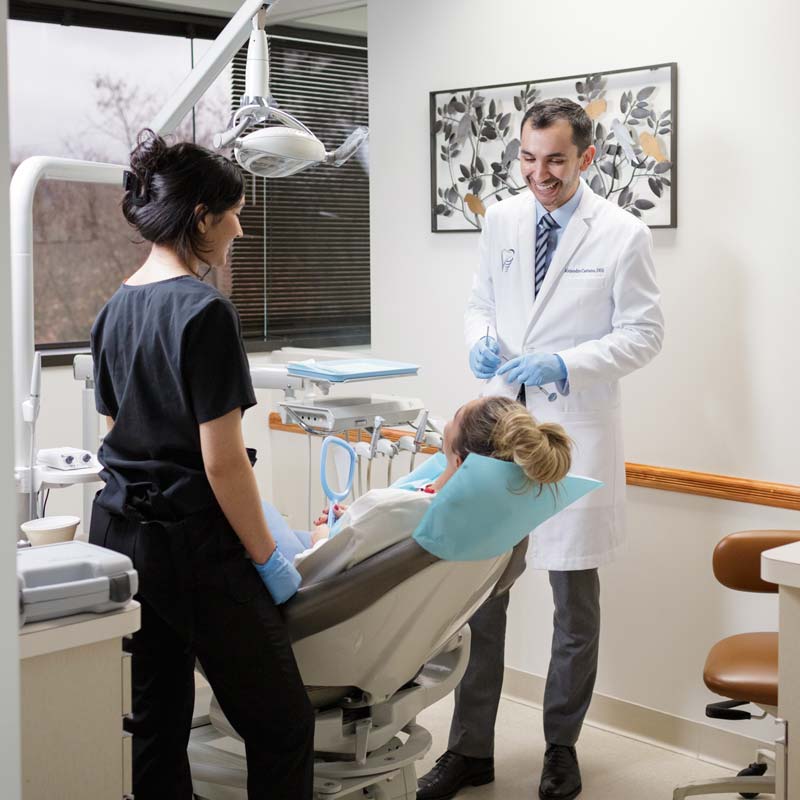 Dr. Castaño Denville Dental Implant Specialist with a Patient